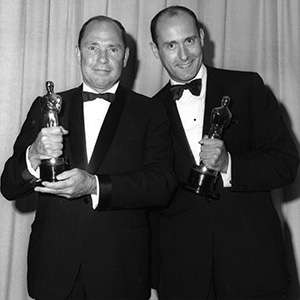 Henry Mancini (right) and Johnny Mercer with their Best Song Oscars for “Moon River.”
