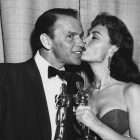 Black and white photo of Donna Reed and Frank Sinatra with their Oscars