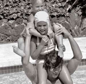 Michael Landon in an undated photo in pool with kids