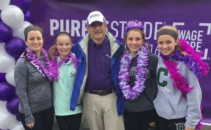 Ken Cunzeman, PanCAN volunteer in Maryland, with his granddaughters at PanCAN PurpleStride