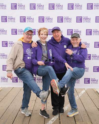 Four-year survivor Eric Idle (second from right) with Trek Against Pancreatic Cancer team members (from left to right) John Billingsley, Kitty Swink, a 19-year pancreatic cancer survivor, and Armin Shimerman posing for a picture at PanCAN PurpleStride Los Angeles.