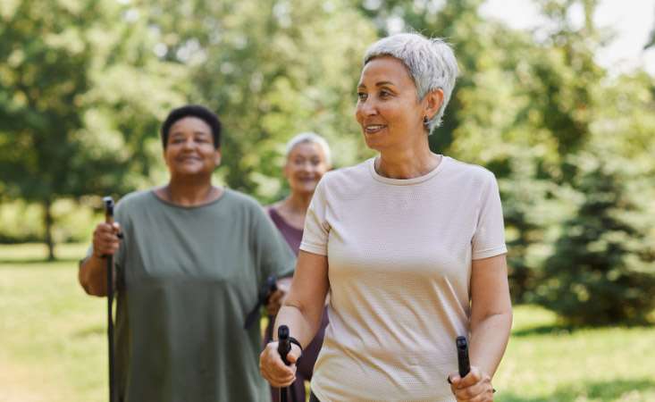 Three women exercising outdoors