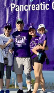 Five members of PurpleStride team Weinstein Warriors on stage at PurpleStride 2025.